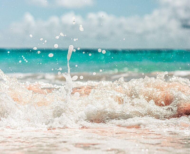 water waves on shore during daytime