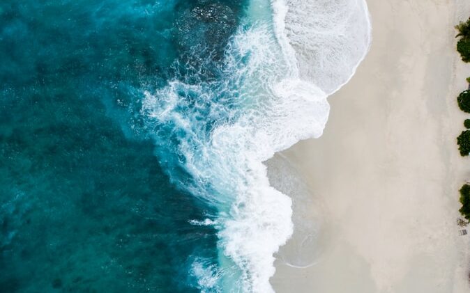 aerial photography of large body of water and shoreline